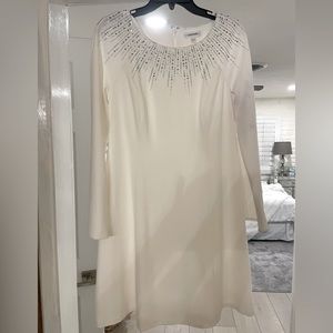 Womens dress.  Worn once.  Small makeup stain on front neck colar.